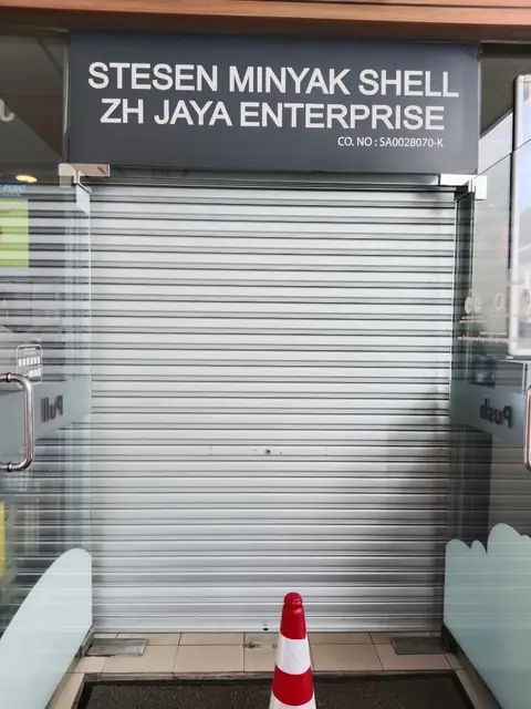 Commercial roller shutter at a petrol station entrance